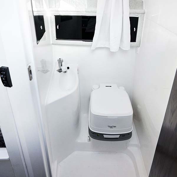 bathroom with shower and toilet